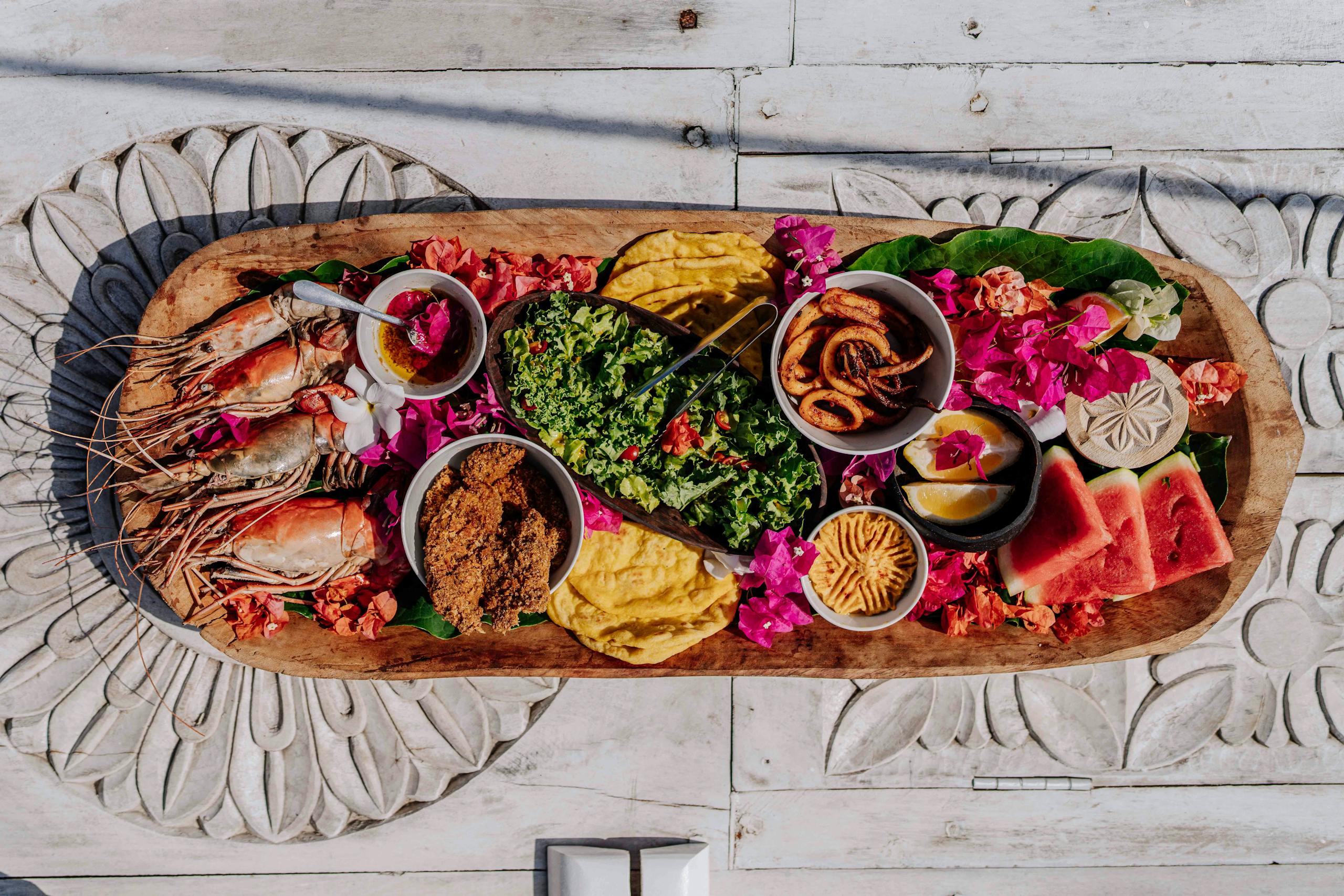 Authentic Zanzibar seafood platter with fresh tropical fruits and local delicacies.