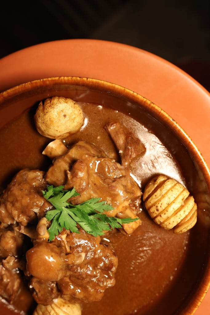 Delicious homemade pork stew with potatoes served in a rustic bowl, perfect for cozy dinners.