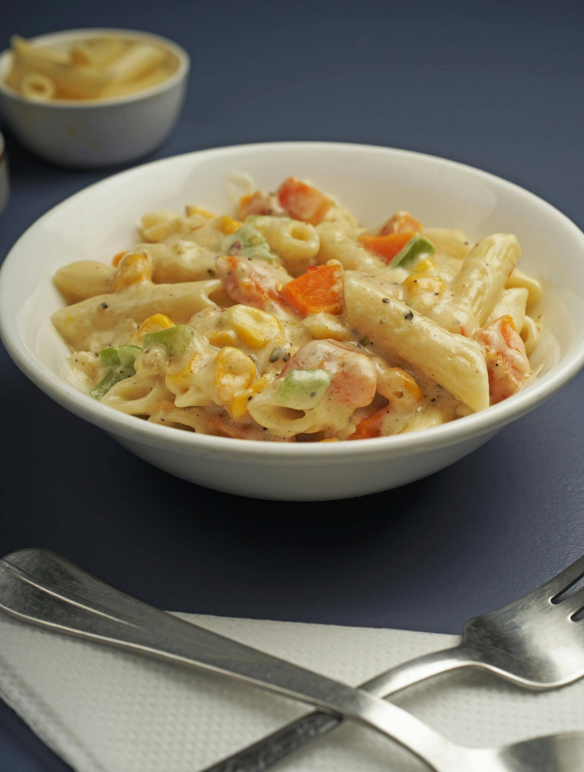 Tasty penne pasta in a rich tomato sauce, topped with parmesan cheese.